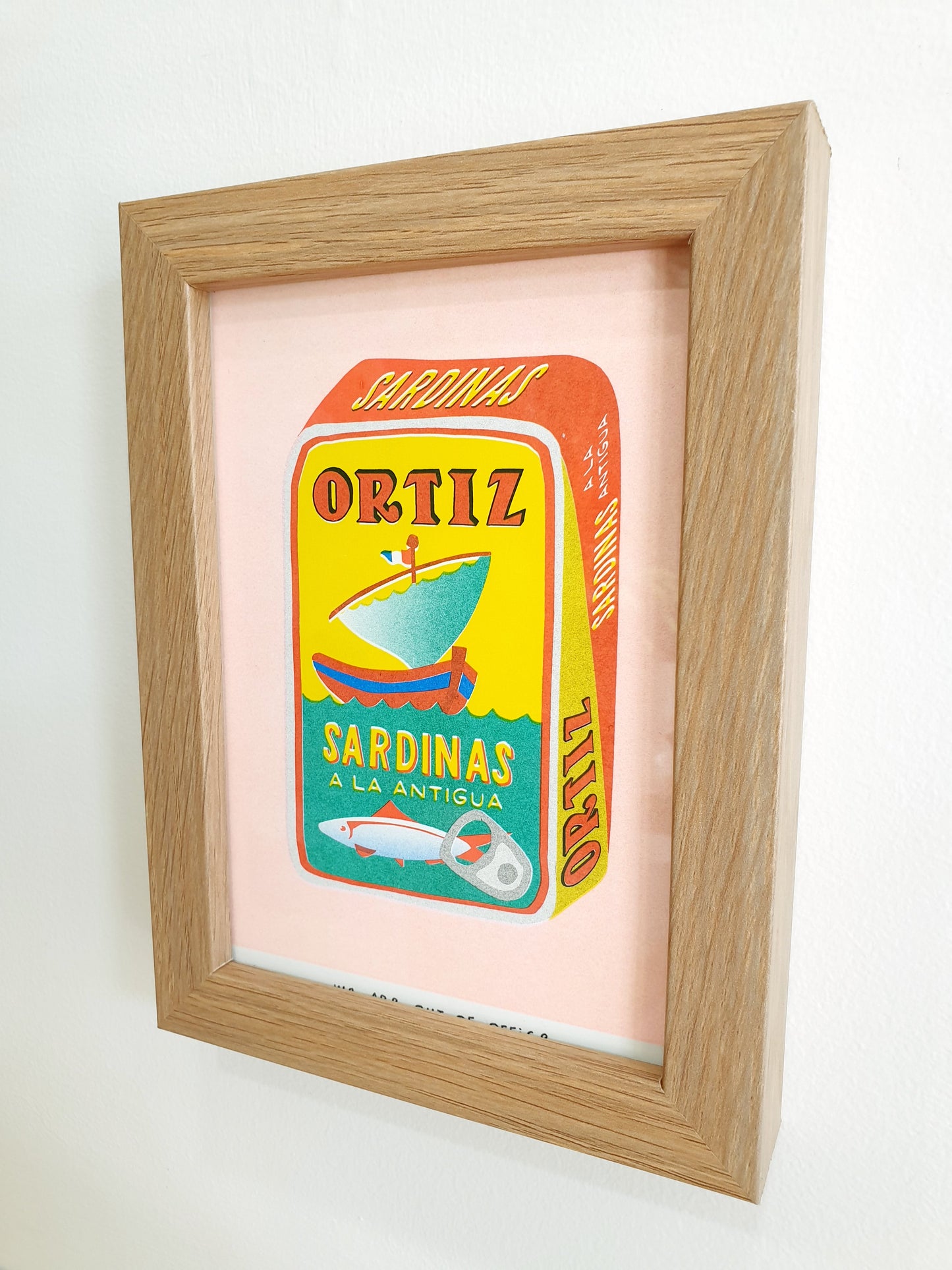 'A can full of sardines' - A framed risograph print.